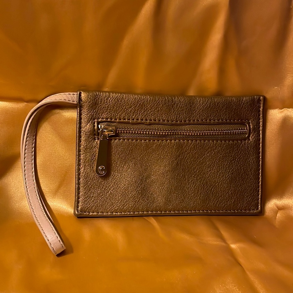 C brass colored Small Wristlet with tan strap with gold zipper with C on pull